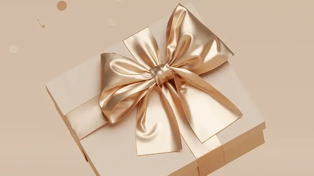 Geburtstagsgeschenk Wellness in Leipzig: Geschenkbox mit goldener Schleife, Gutschein von RELAX plus